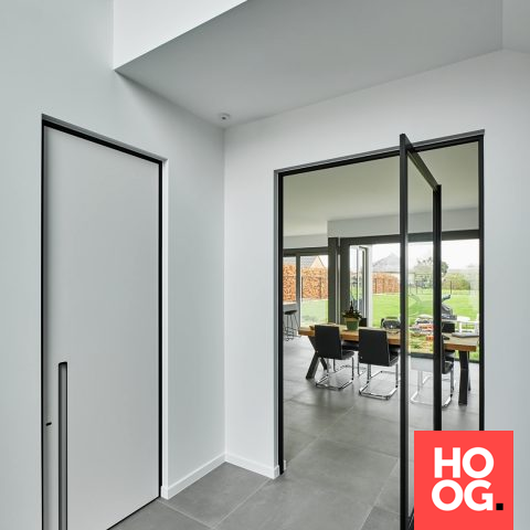 Sleek interior with black / white interior doors and a steel look pivot door